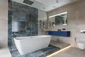 Modern walk-in shower with large format tile installed during shower remodeling in Hurst TX