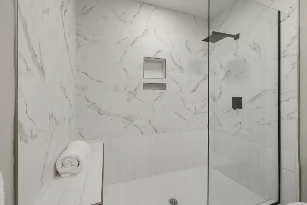 Newly tiled walk-in shower installed during permitted bathroom remodel in DFW home