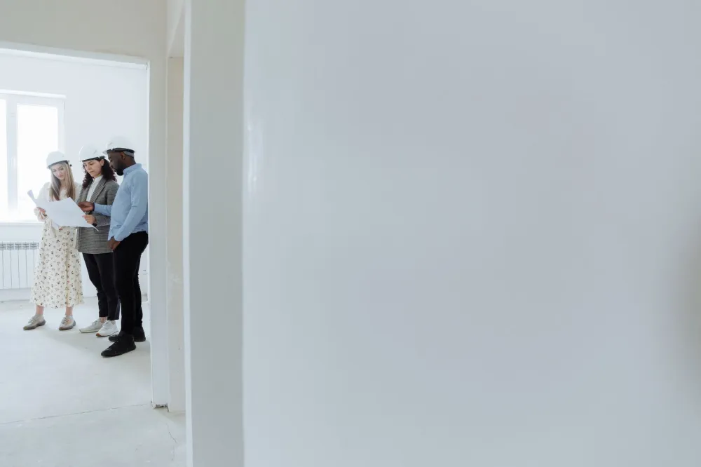 Licensed contractor reviewing building permit documents for a home remodel in Arlington Texas