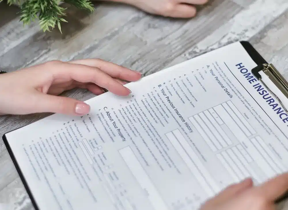 Homeowner carefully reading a remodeling contract before signing to avoid costly surprises