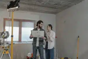 Contractor reviewing remodeling plans with homeowner to avoid common renovation mistakes in Arlington TX