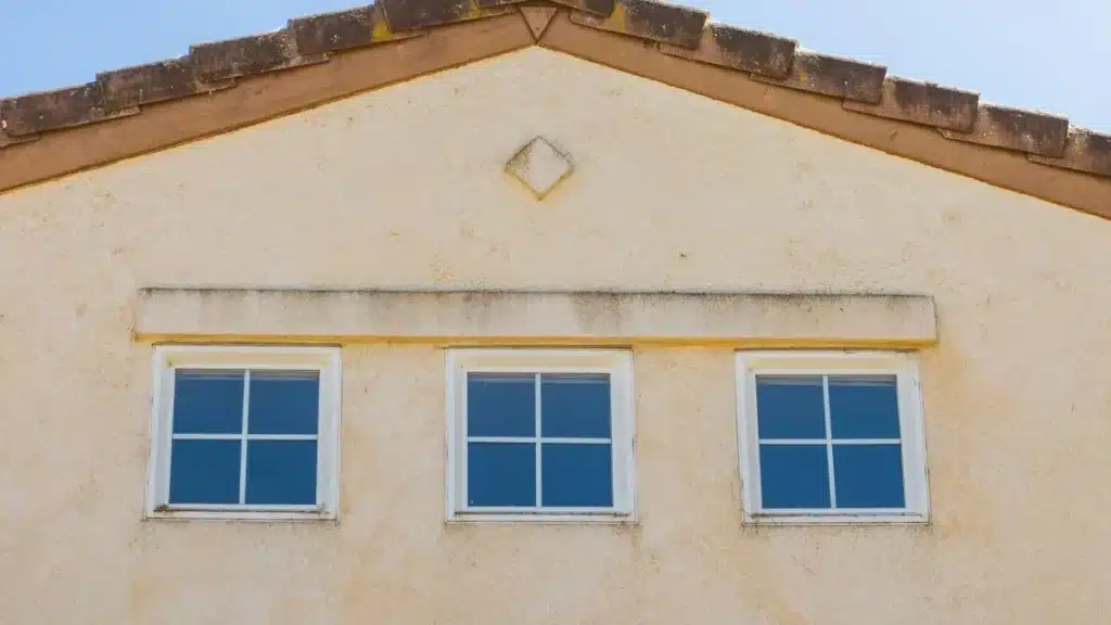 Contractor installing replacement windows on a brick home in Arlington TX