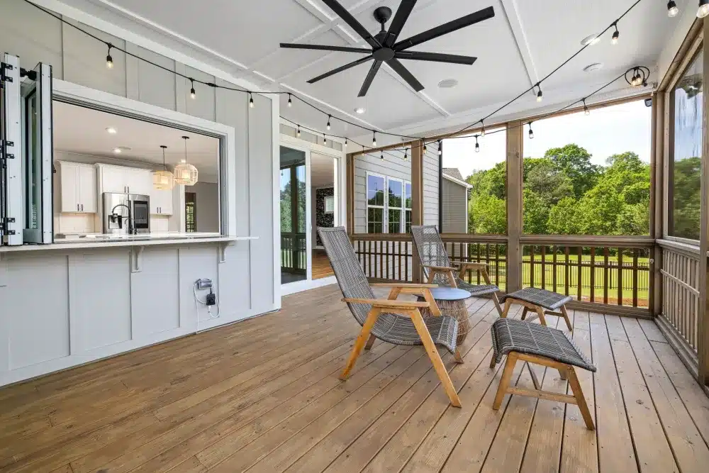 Large damp-rated ceiling fan installed under a covered patio roof for summer heat relief in Bedford TX