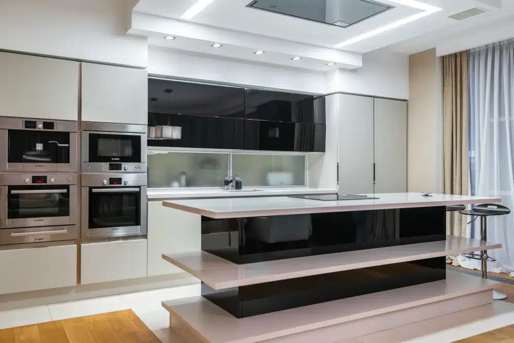 Contractor installing new shaker cabinets during a kitchen remodel in a Texas home