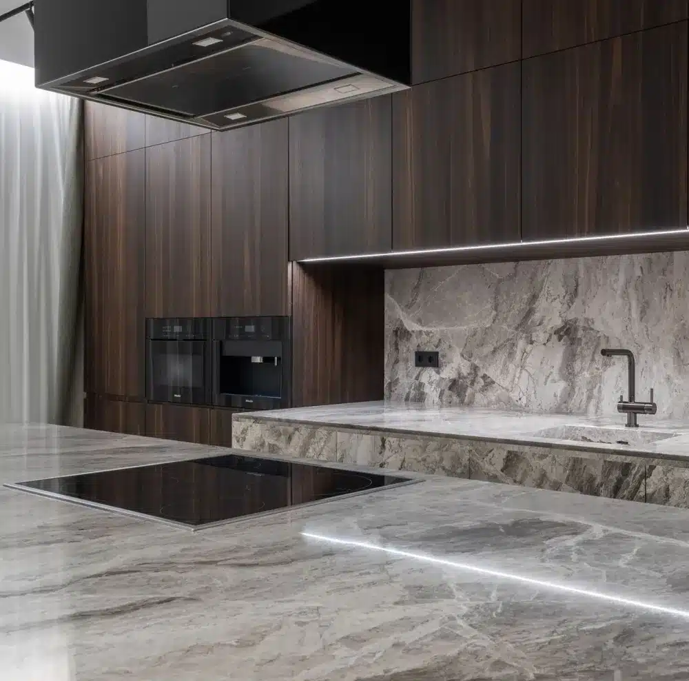 Contractor installing quartz countertops in a remodeled kitchen near Arlington TX