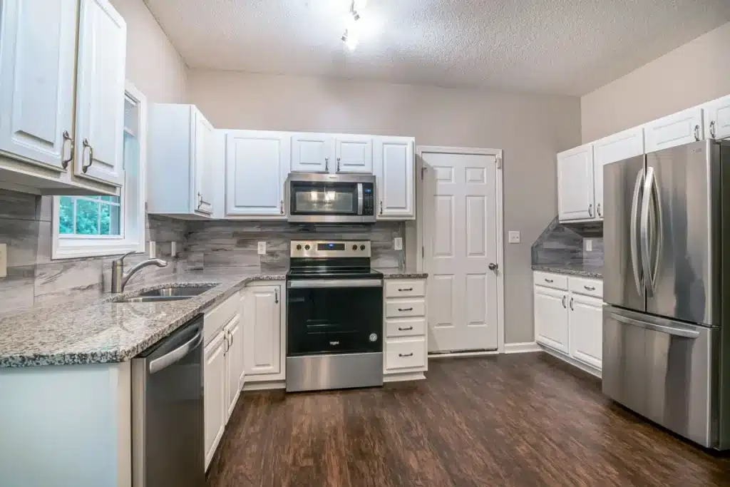 Bright modern kitchen remodel showing new cabinets and countertops in Hurst TX home