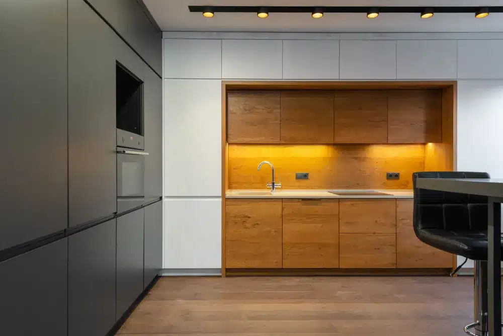 Under-cabinet lighting and brushed nickel hardware finishing a kitchen remodel in Hurst TX