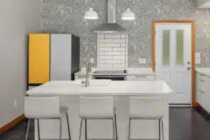 Bright open-concept kitchen remodel in a Hurst TX home with white cabinetry and quartz countertops