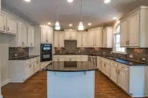 Bright modern kitchen remodel in a Bedford TX family home with white cabinetry and quartz countertops