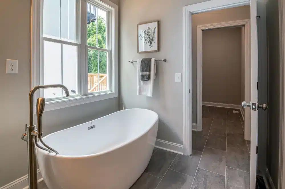 Freestanding soaking tub as a master bathroom remodel centerpiece in a Texas home