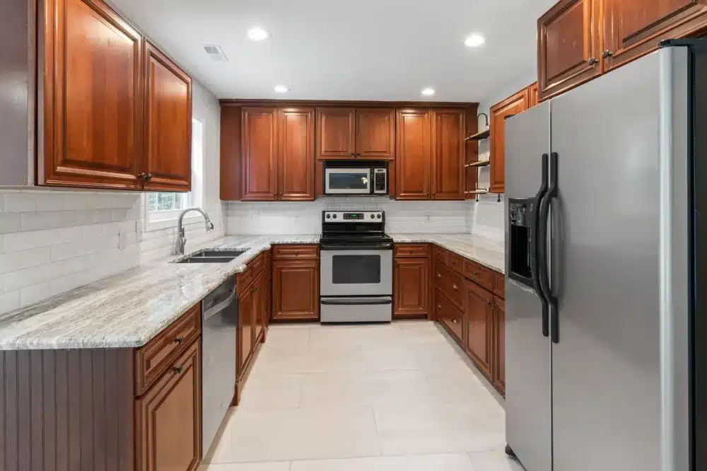 Licensed kitchen remodeling contractor installing cabinets in an Arlington TX home