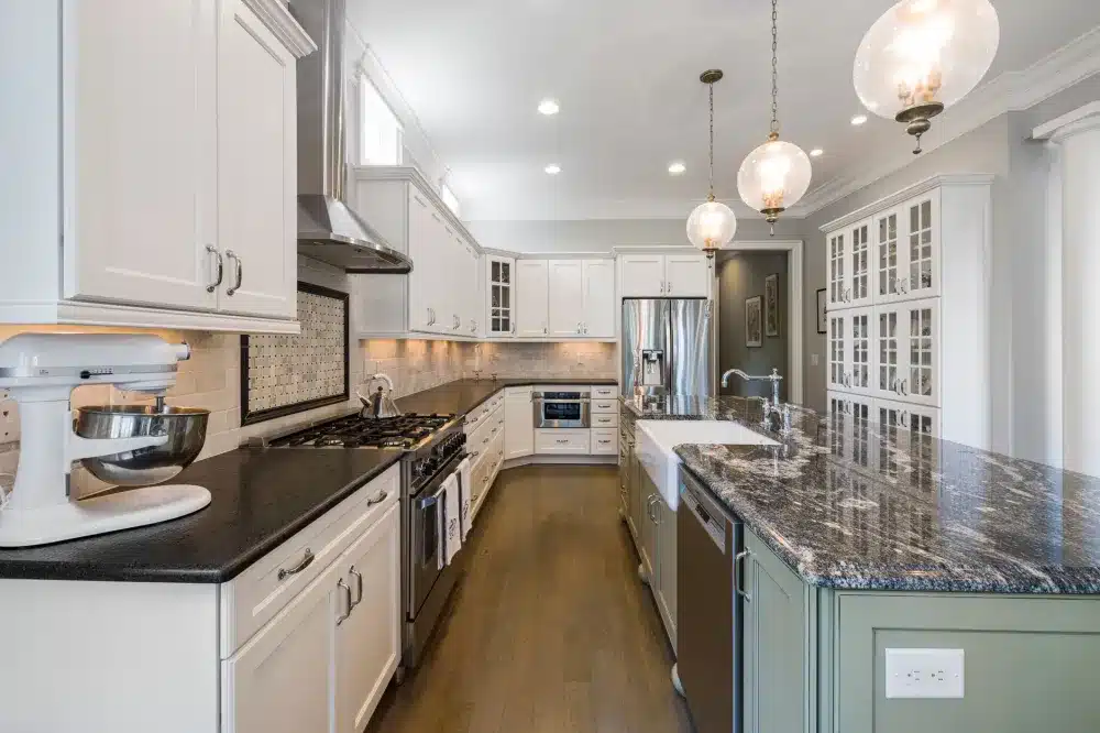Modern kitchen island with pendant lights in open-concept DFW home renovation