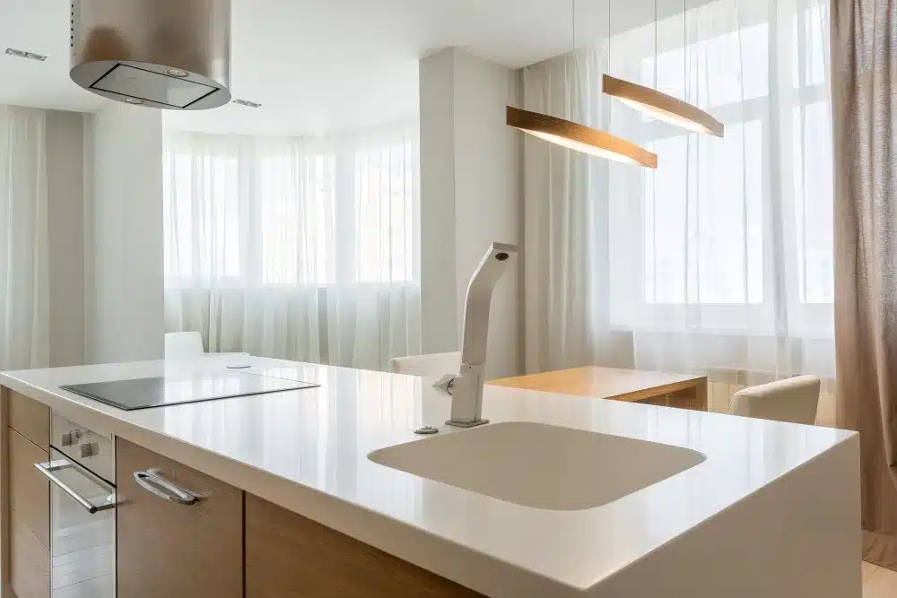 Bright white quartz countertop on a kitchen island during a Hurst TX remodel