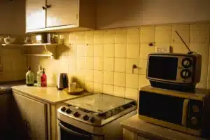 Retro-style kitchen remodel with bold color cabinets and quartz countertops in Arlington TX home