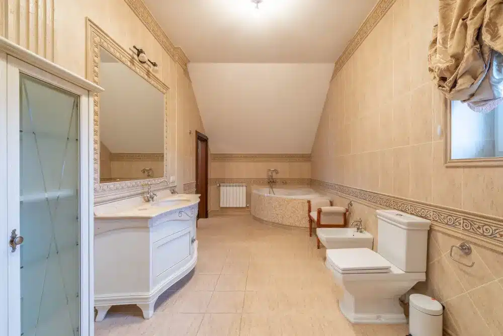 Water-damaged bathroom tile and mold showing need for professional bathroom remodeling in Arlington TX