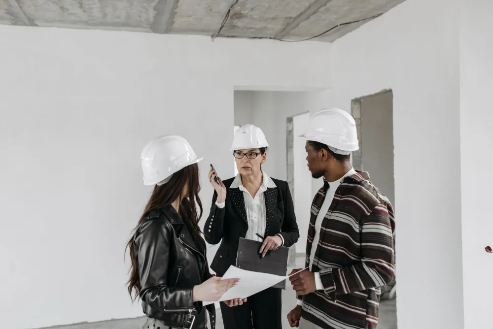 Licensed remodeling contractor reviewing bathroom renovation plans with Arlington TX homeowner