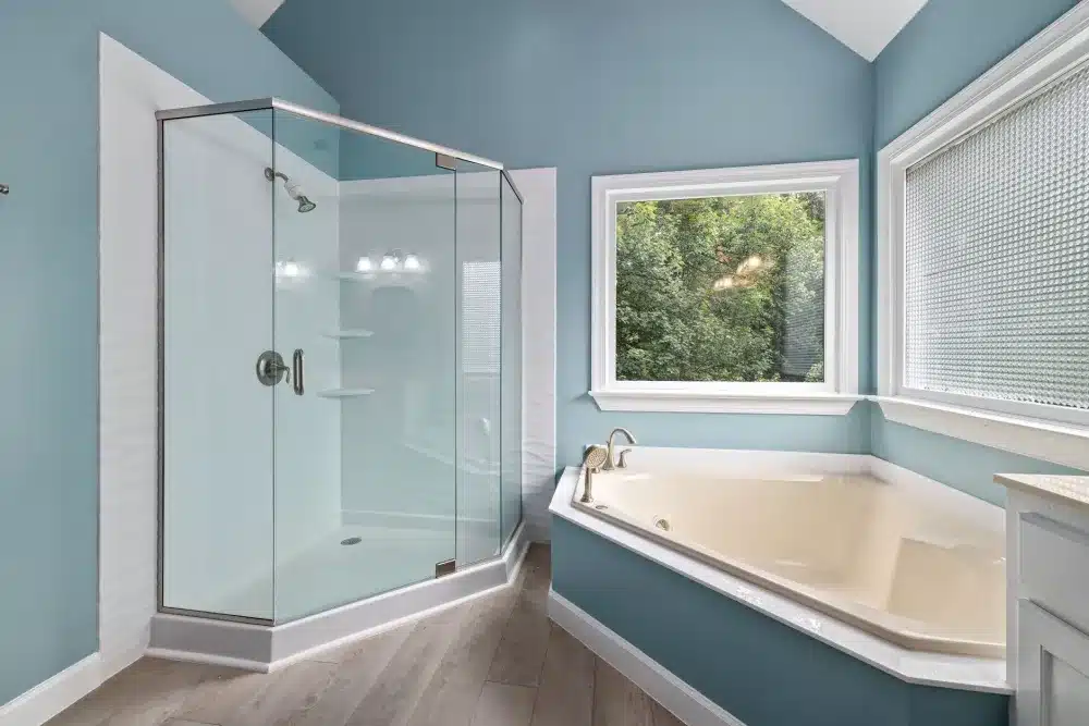 Frameless glass shower enclosure in a compact bathroom making space feel larger