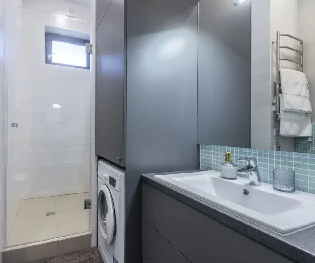 Modern small bathroom remodel with floating vanity and large-format tile in Arlington TX home