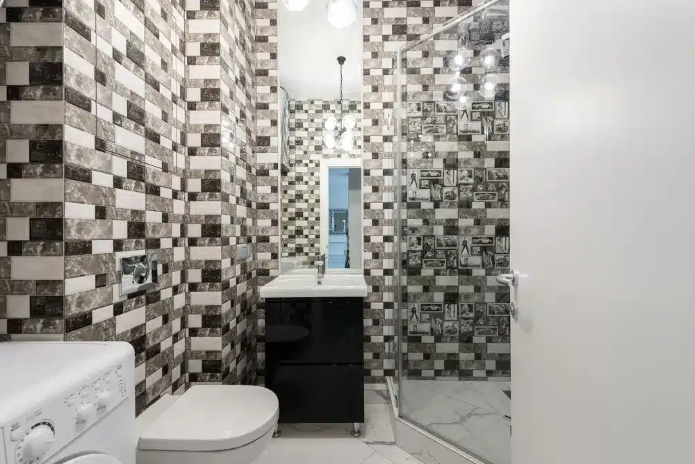 Acrylic shower surround panel installation during a mid-range bathroom remodel