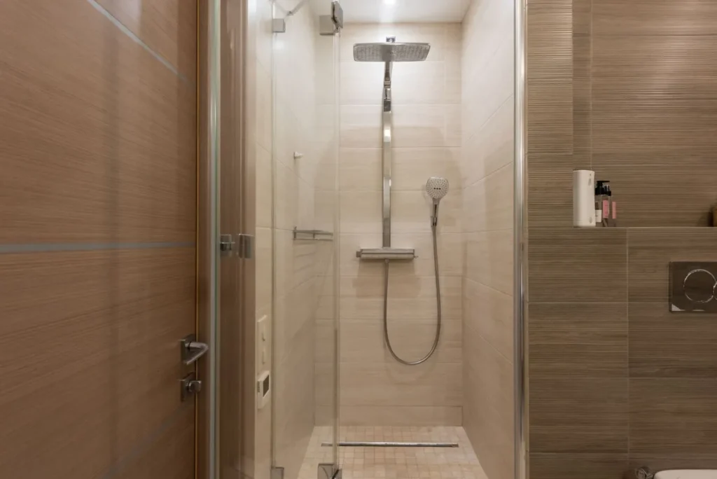Modern walk-in shower remodel with large format tile in Arlington TX bathroom