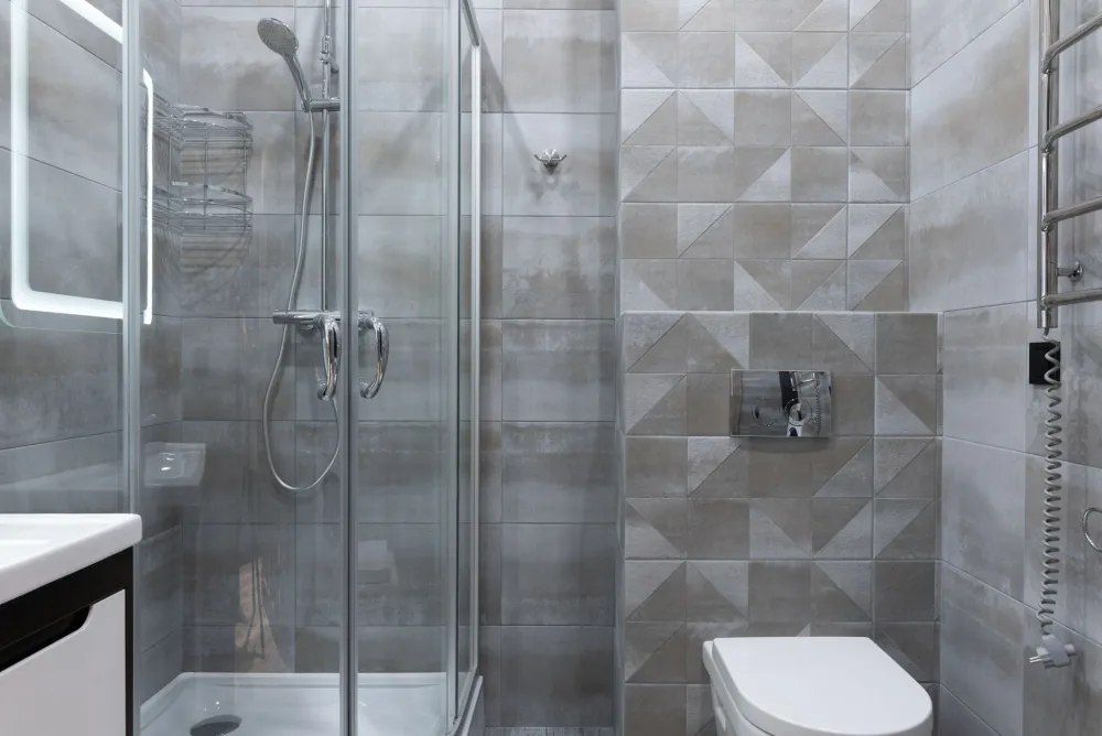 Variety of shower tile and wall panel material samples for bathroom remodel