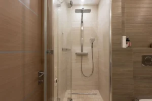 Modern walk-in shower remodel with large format tile in Arlington TX bathroom