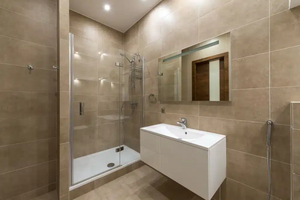 Frameless glass shower enclosure in a renovated Arlington Texas master bathroom