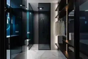 Modern walk-in shower with large-format tile and frameless glass in Arlington TX bathroom remodel