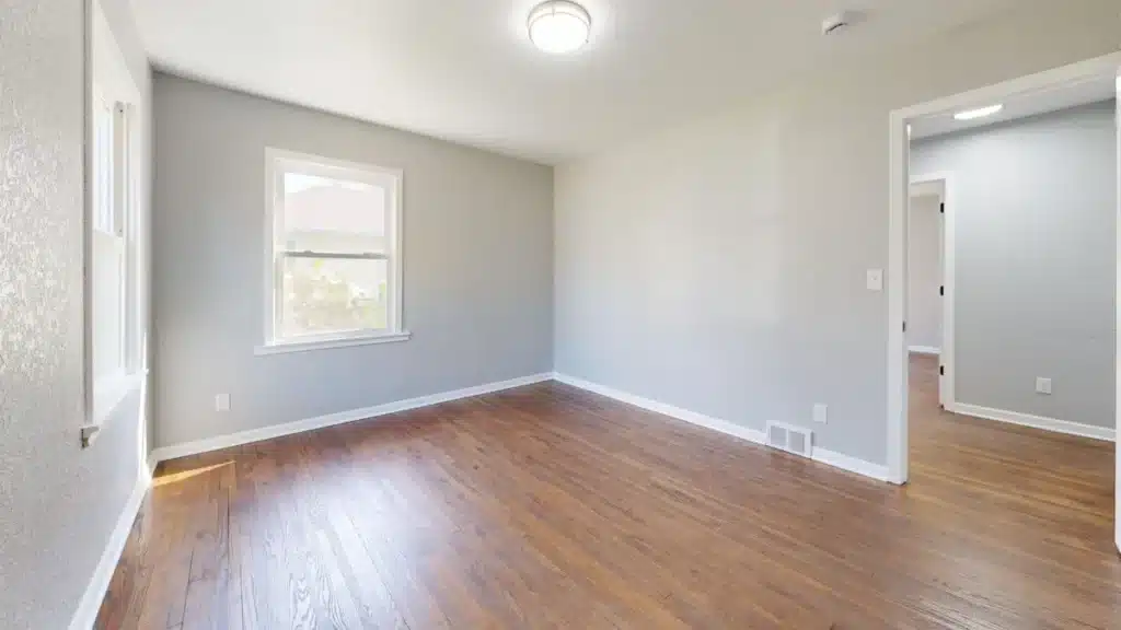Living room of an older brick slab home in Ash Meadows, Fort Worth prepared for a home renovation