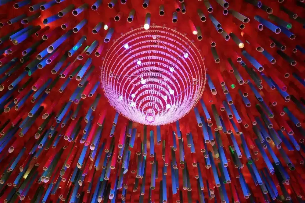 Red and blue PEX water lines routed through the attic of an Arlington ranch home during a remodel