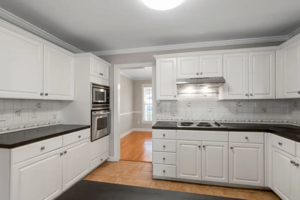 Remodeled kitchen with upper cabinets reaching the ceiling in an Arlington, TX home