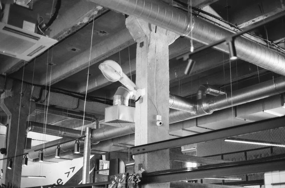 Open kitchen ceiling showing ductwork exposed during soffit removal