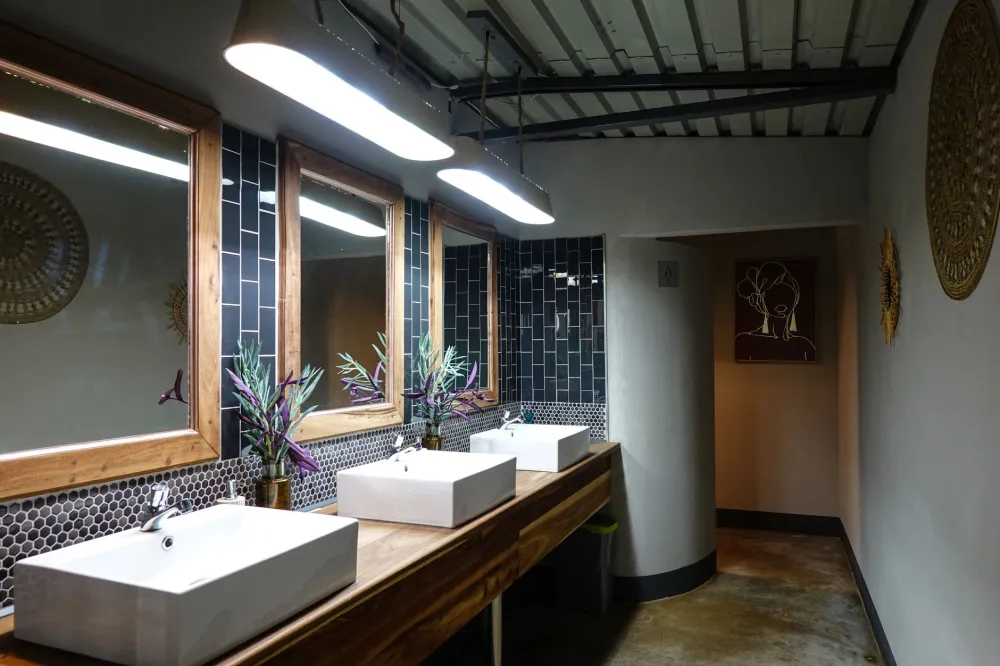 Warm white LED fixtures flanking a bathroom mirror