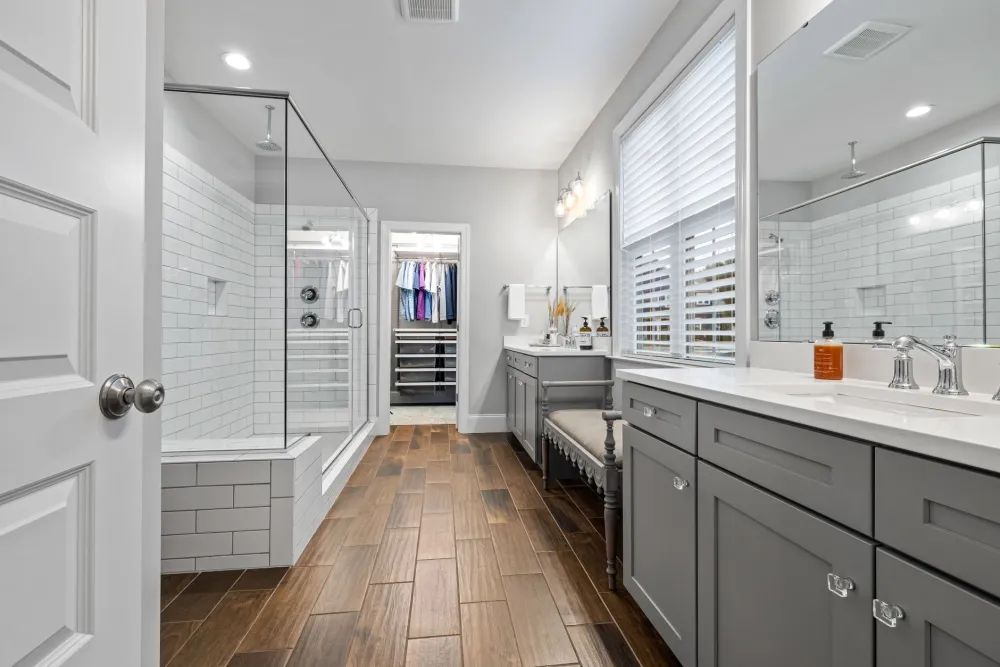 Wet-rated recessed light inside a tiled walk-in shower
