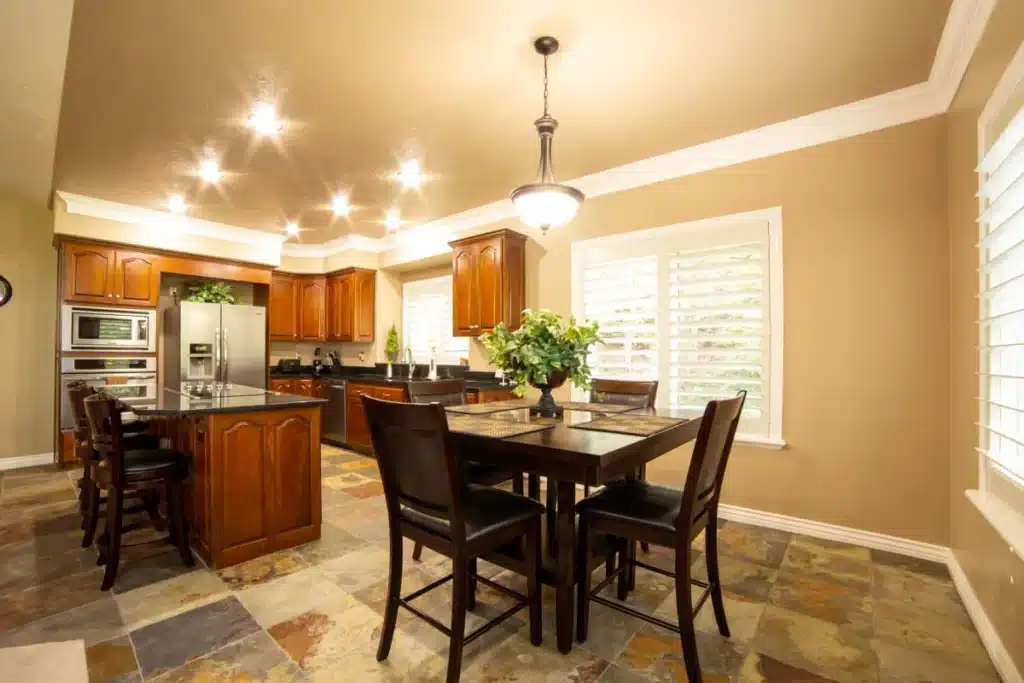 Living room and kitchen of an Arlington home mid-remodel with a plastic dust barrier