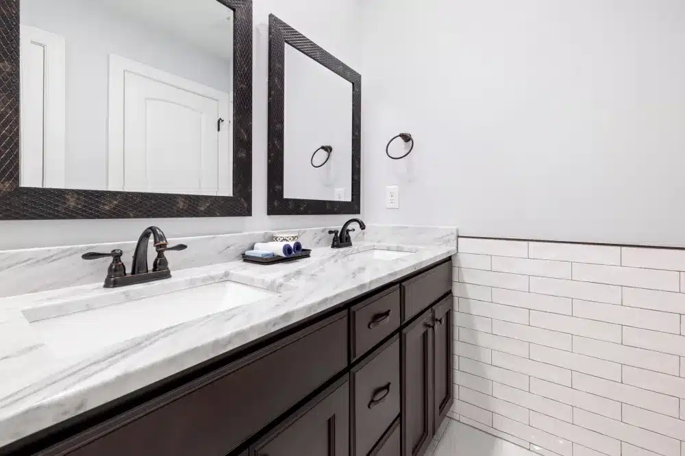 Clean renovated bathroom with new vanity and tile in a DFW rental home